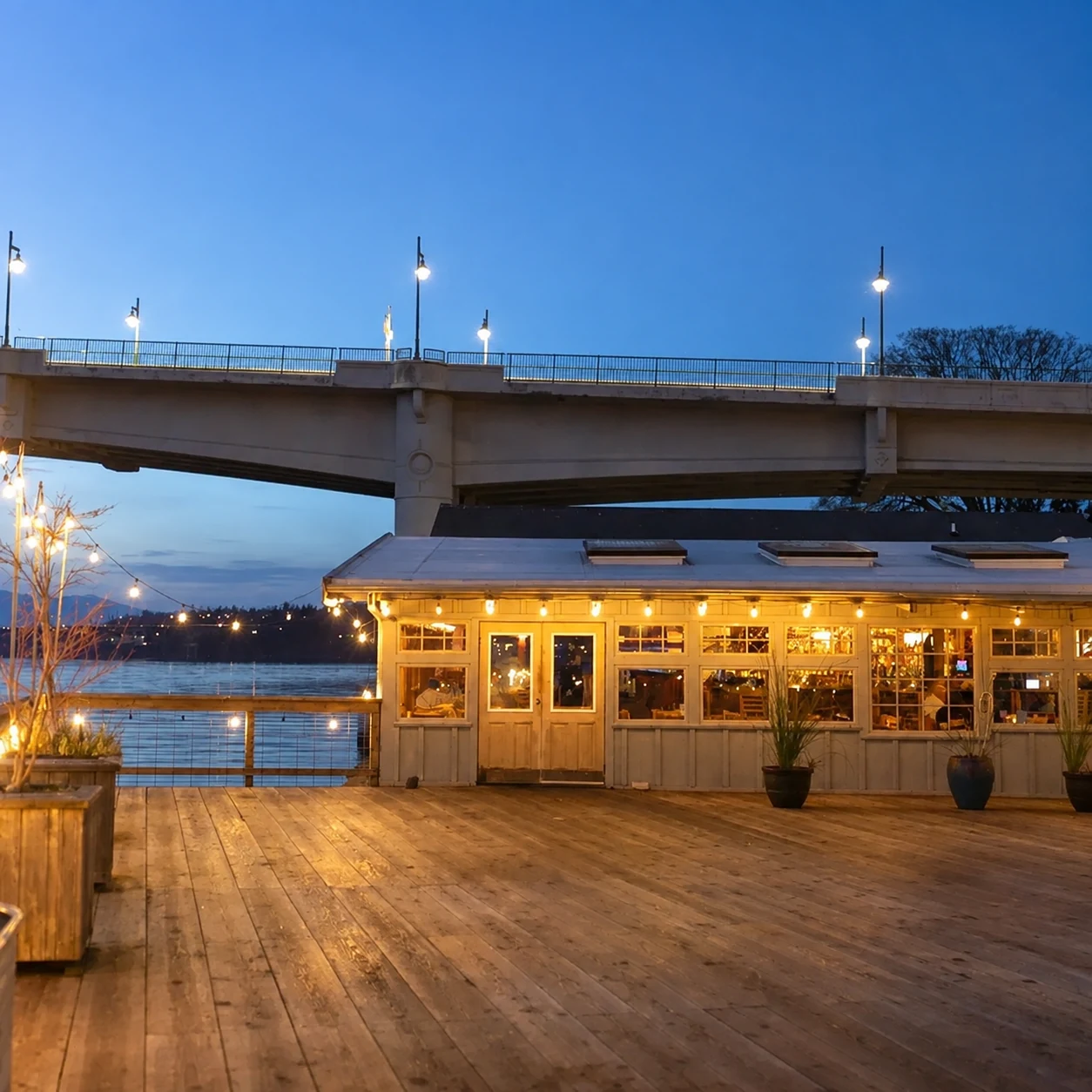 The Boat Shed waterfront patio at dusk